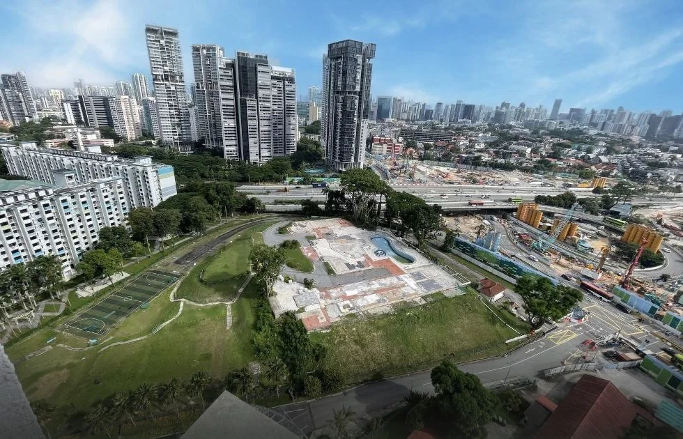 Aerial photo of the vacant 8 Thomson Lane site with its old pool, beside the Pan-Island Expressway and North-South Corridor works, with Novena towers behind